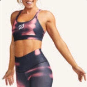 Peloton pink and dark grey workout set. Large Sports Bra and Medium Capris.
